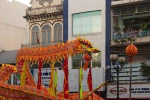 Ho Chi Minh city, Vietnam - 6 Feb 2023 Lunar New Year celebration - The dragon dance, beautiful colorful festive figure. Tet holiday background. Chinese Lunar New Year's Day, Spring Festival. photo