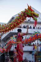 Ho Chi Minh city, Vietnam - 6 Feb 2023 Lunar New Year celebration - The dragon dance, beautiful colorful festive figure. Tet holiday background. Chinese Lunar New Year's Day, Spring Festival. photo