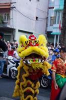 Ho Chi Minh city, Vietnam - 6 Feb 2023 Lunar New Year celebration - The dragon dance, beautiful colorful festive figure. Tet holiday background. Chinese Lunar New Year's Day, Spring Festival. photo