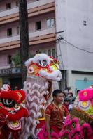 Ho Chi Minh city, Vietnam - 6 Feb 2023 Lunar New Year celebration - The dragon dance, beautiful colorful festive figure. Tet holiday background. Chinese Lunar New Year's Day, Spring Festival. photo