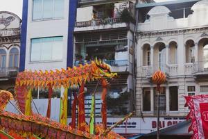 Ho Chi Minh city, Vietnam - 6 Feb 2023 Lunar New Year celebration - The dragon dance, beautiful colorful festive figure. Tet holiday background. Chinese Lunar New Year's Day, Spring Festival. photo