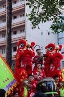 Ho Chi Minh city, Vietnam - 6 Feb 2023 Lunar New Year celebration - The dragon dance, beautiful colorful festive figure. Tet holiday background. Chinese Lunar New Year's Day, Spring Festival. photo