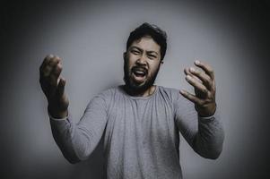 Asian handsome man angry on white background,Portrait of young Stress male concept photo