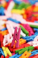 Colorful Wooden clothespins close-up as texture and background. photo