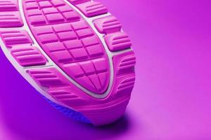 Violet sole of a sports sneaker close-up. photo