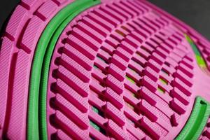 Pink sole tread with sports sneakers for jogging and fitness. photo