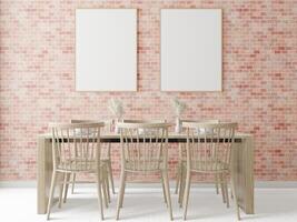 A set of tables and chairs in the room with a picture frame attached to wall. photo