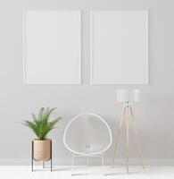 Picture frame attached to the wall, with chairs and vases placed on the table. photo