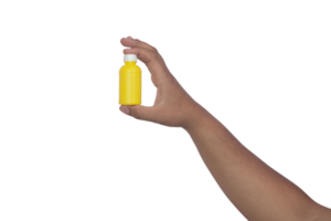 Asian man's hand is holding a yellow plastic bottle, product concept photo png