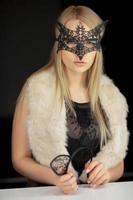 Nice young woman in a mask photo