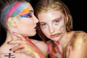 Two sexy young women with creative make-up photo