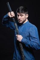 Nice young man posing in studio photo