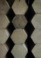 Pile of pentagonal paving bricks at a building materials store. photo