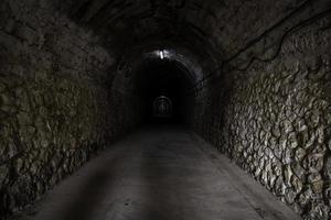 Gloomy tunnel in the dark photo