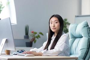Portrait of successful Asian office worker woman, business woman working photo