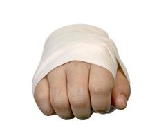 closeup right hand fist with elastic bandage isolated on white background,clipping path photo