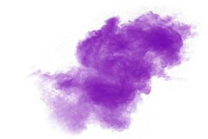 Purple particles explosion on white background.Freeze motion of purple dust splash on background. photo