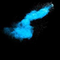 Blue color dust particles explosion cloud on black background.Color powder splash. photo