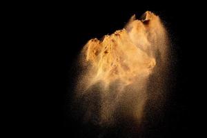 Brown dry river sand explosion isolated on white background. Abstract sand splashing. photo