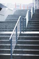 Staircase with metal handrail. photo