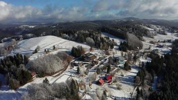 Aerial view of a snowy hotel in Beskydy mountains video