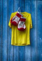 T-shirt and boxing glove on the wall photo