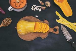 pumpkin on a wooden kitchen board photo