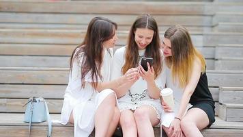 Lifestyle selfie portrait of young positive girls having fun and making selfie. Concept of friendship and fun with new trends and technology. Best friends saving the moment with modern smartphone video