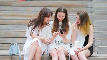 Lifestyle selfie portrait of young positive girls having fun and making selfie. Concept of friendship and fun with new trends and technology. Best friends saving the moment with modern smartphone video