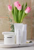 White plastic tube, jar for cosmetics. Container for gel, cream, tonic. Advertising and product promotion photo