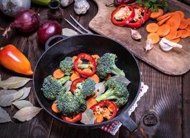 fresh pieces of broccoli, carrots and red peppers photo