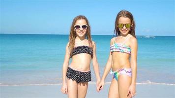 Kids having fun at tropical beach during summer vacation playing together. video