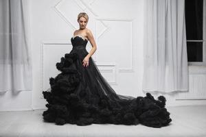 Young lovely woman wearing in a magnificent evening dress photo