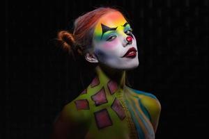 Beautiful young woman with a face painting photo