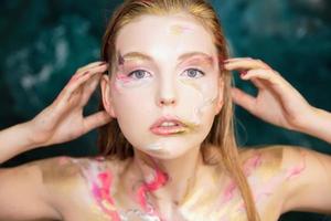 Young lovely woman with creative make up photo