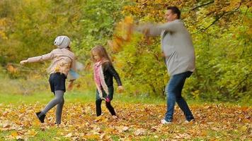 Happy family in autumn park enjoy warm day video