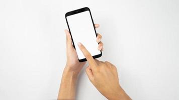 Hands touch blank smartphone isolated photo