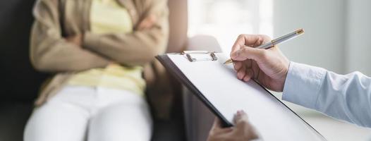 psychologist talking with depressed patient about mental condition. photo