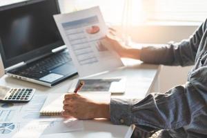 Tax deduction planning concept. Businessman calculating business balance prepare tax reduction. photo