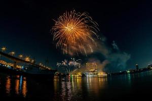 fireworks on the river in the dark sky photo