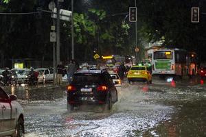 Rio, Brazil - february 13, 2023, flooded streets after heavy rain in the city this Monday night, cars face problems with flooded roads photo