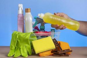 basket with cleaning products for home hygiene use photo