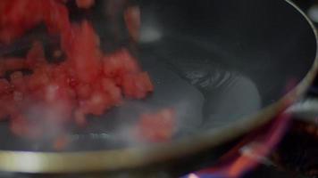 frying tomatoes and fire video