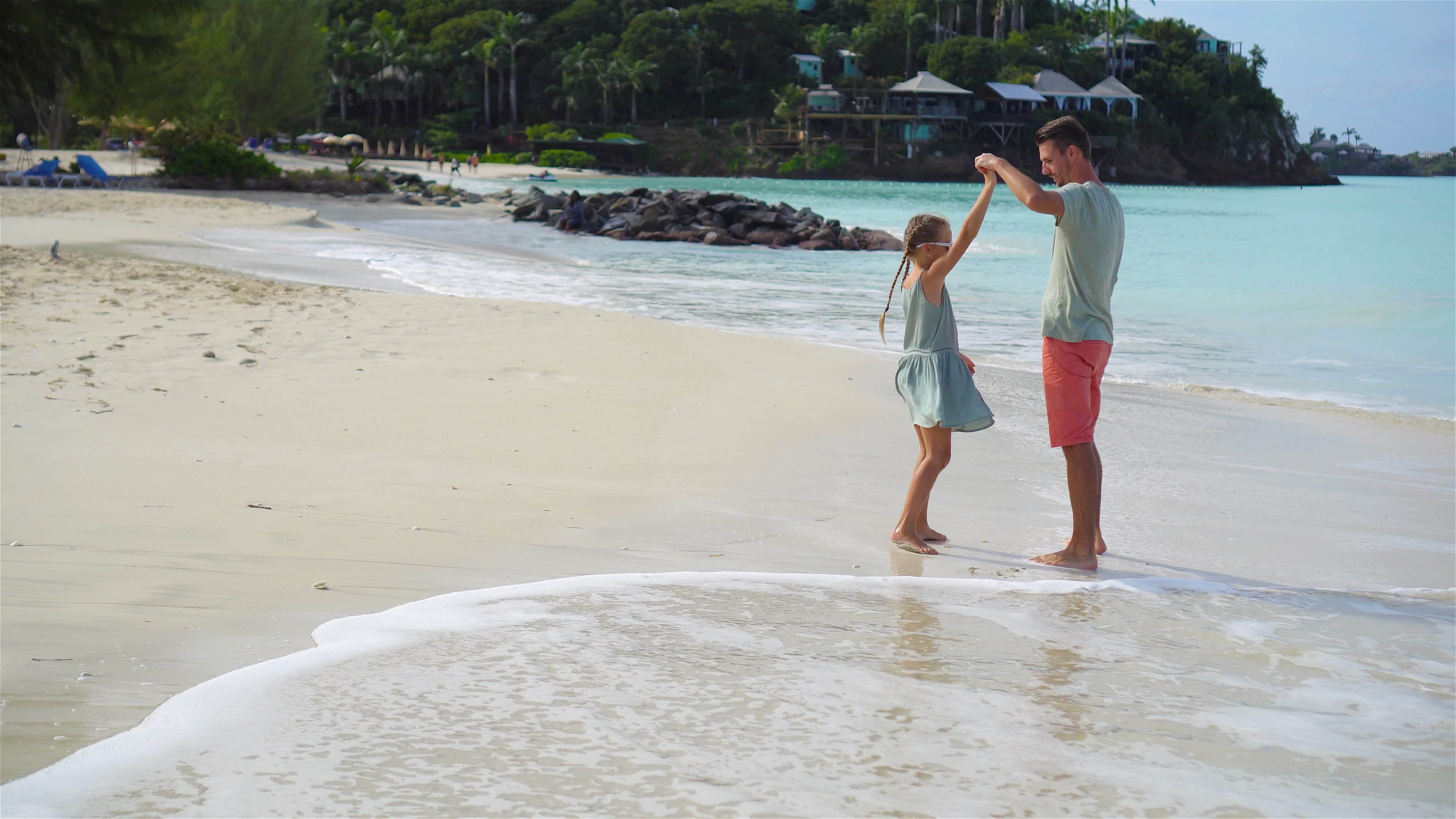 Family Walking On The Beach Dad And Kid Together On The Seashore family-walking-on-the-beach-dad-and-kid-together-on-the-seashore