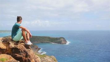 Young man enjoying breathtaking views from Shirley Heights on Antigua island video