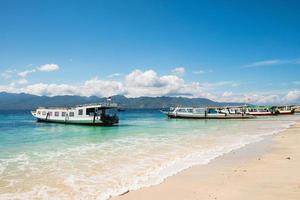 Beautiful view of boats and Lombok island. photo