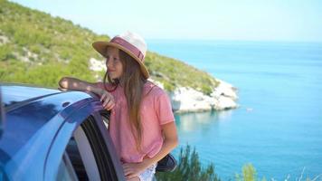 Little girl on vacation travel by car background beautiful landscape video