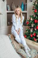 Lovely blonde dressed in pajamas photo