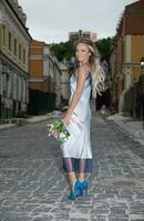 Beautiful woman with a wedding bouquet photo