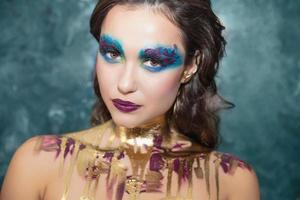 Young lovely woman with creative make up photo